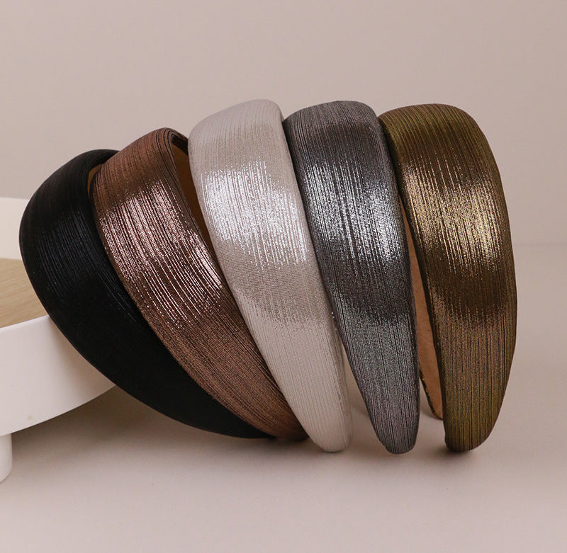 Thinly padded glossy metallic headband
