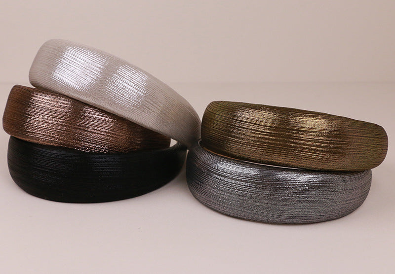 Thinly padded glossy metallic headband