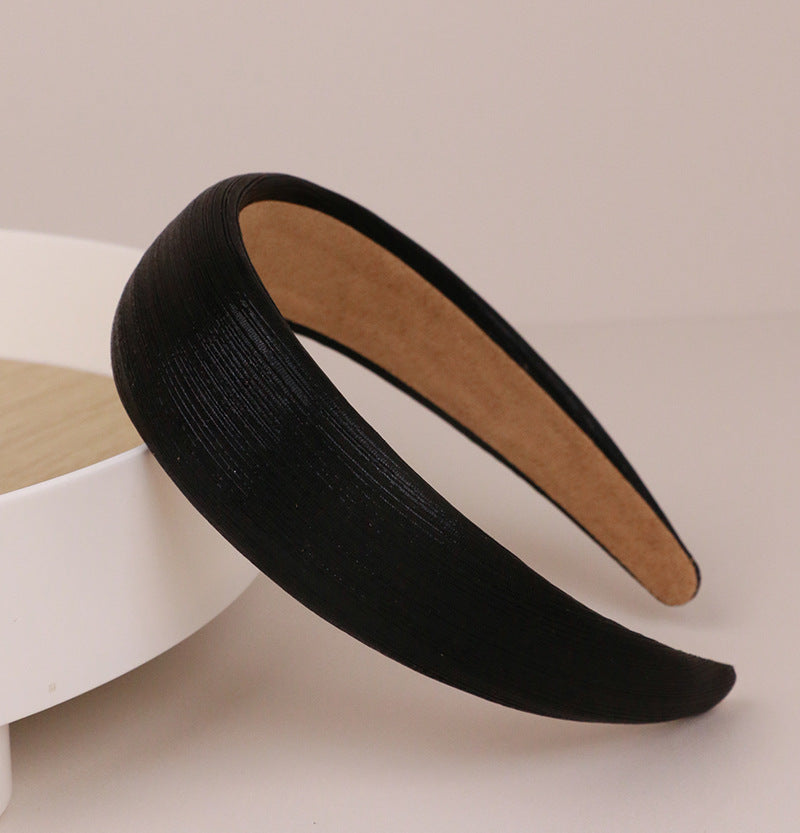 Thinly padded glossy metallic headband