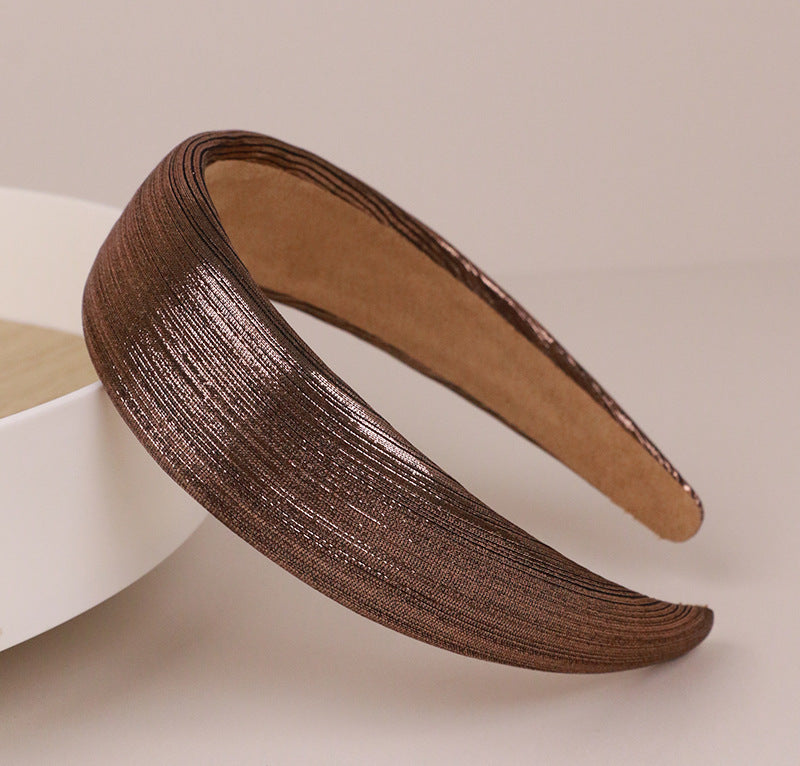 Thinly padded glossy metallic headband