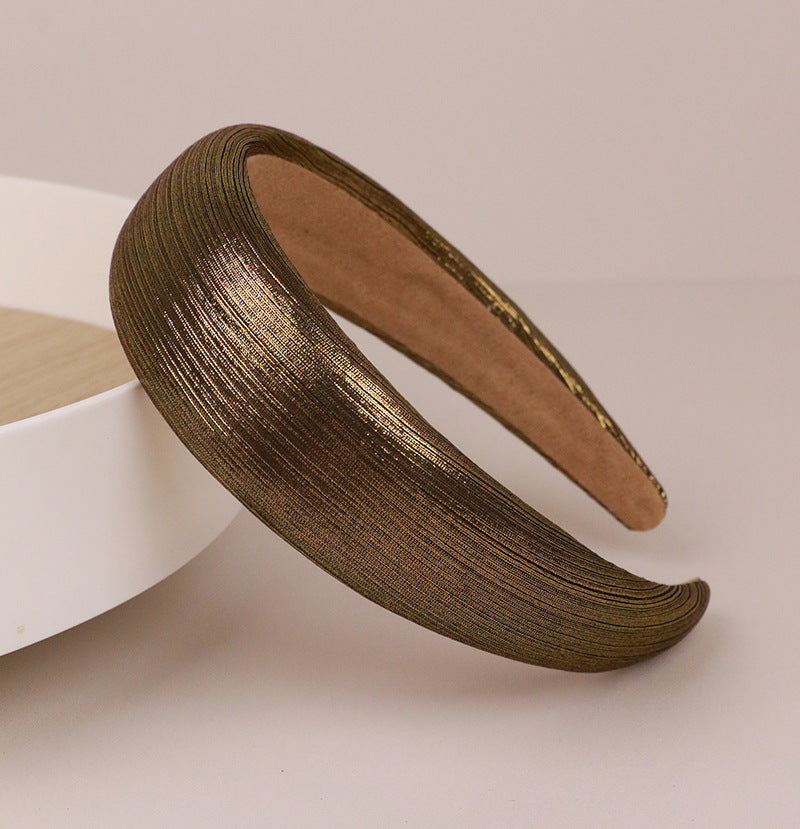 Thinly padded glossy metallic headband