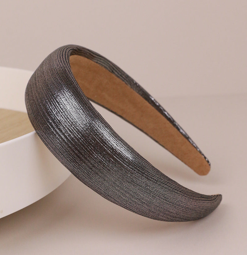 Thinly padded glossy metallic headband