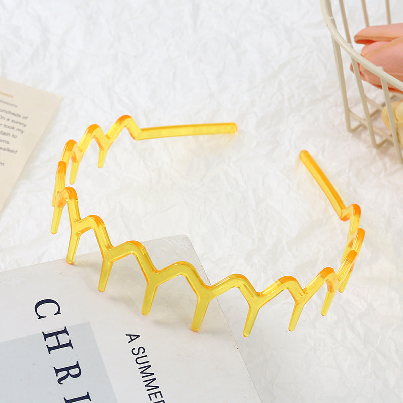 Wavy edge acrylic headband with teeth