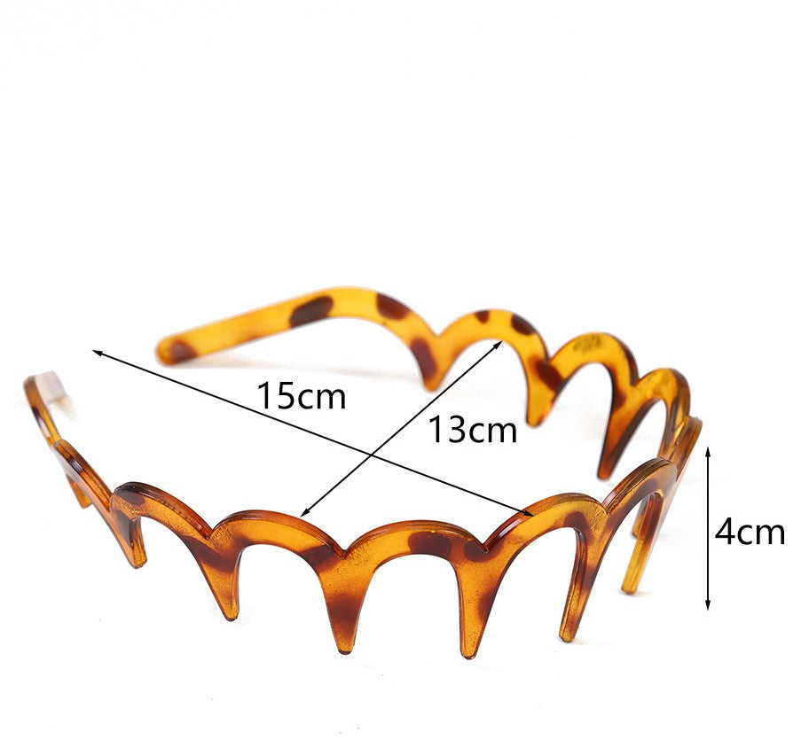 Wavy acrylic headband with teeth