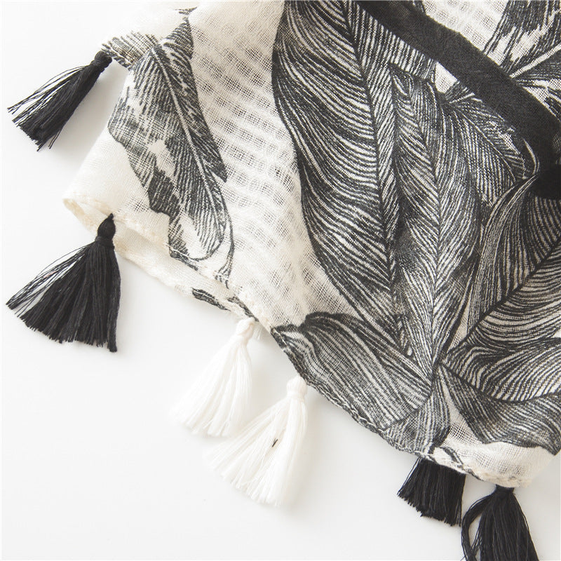 Black large leaves print beige scarf with tassels
