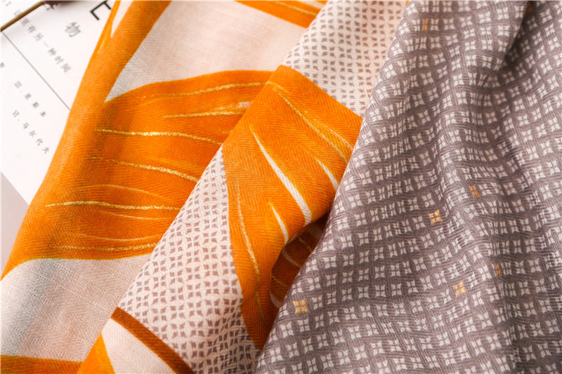 Gold stamped orange yellow leaves print navy grey fringed scarf