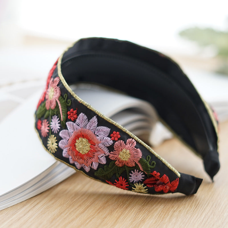 Embroidered flowers on black wide headband