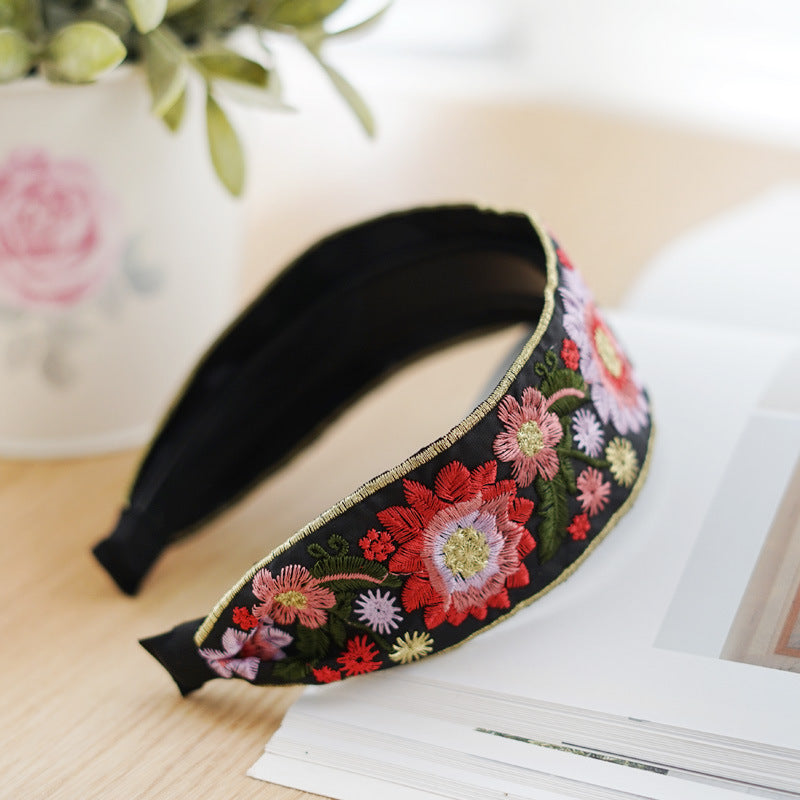 Embroidered flowers on black wide headband
