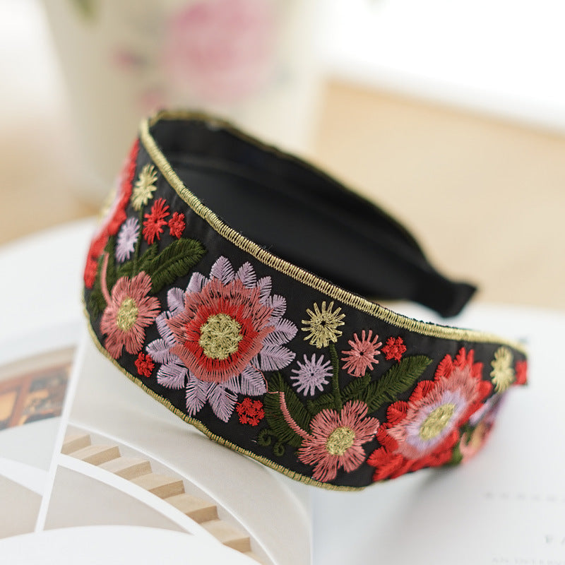 Embroidered flowers on black wide headband