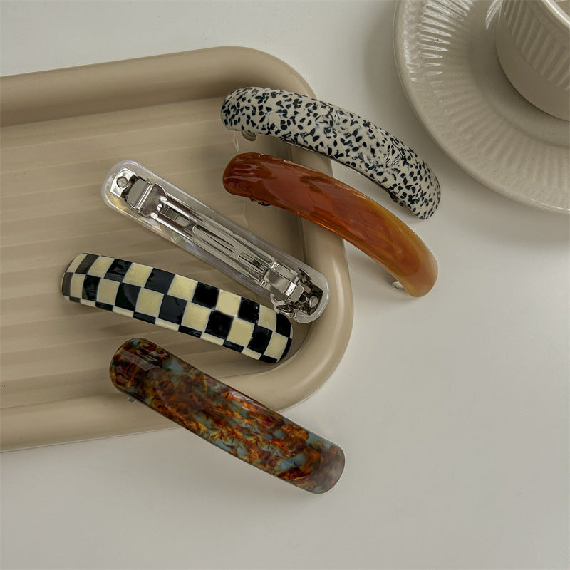 Smooth resin arch rectangle barrette