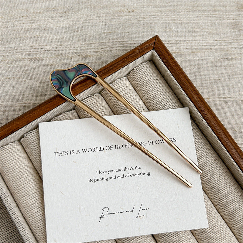Metallic hair fork