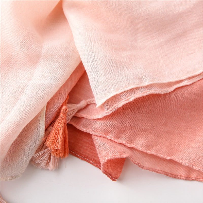 Solid long scarf with tassels in graduated colour pattern