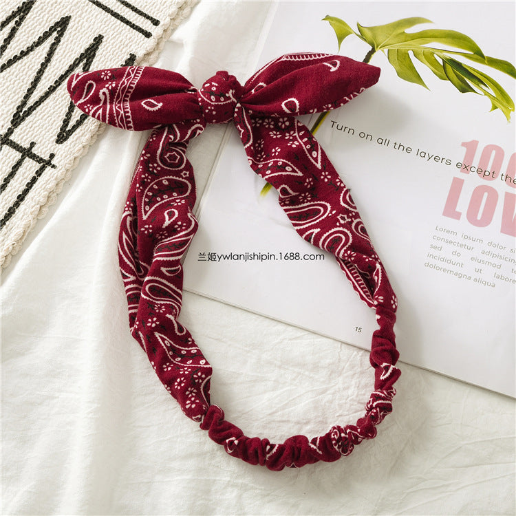 Paisley print elastic headband with bow