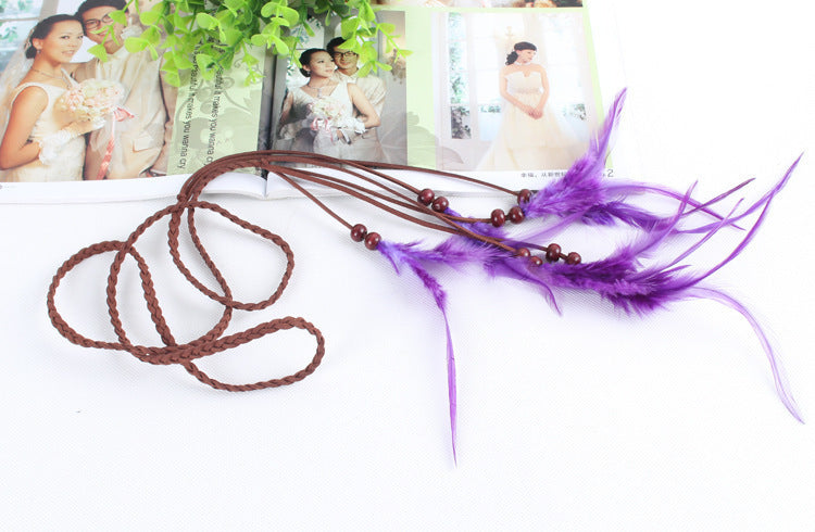 Braided brown suede band with purple feather hair tie