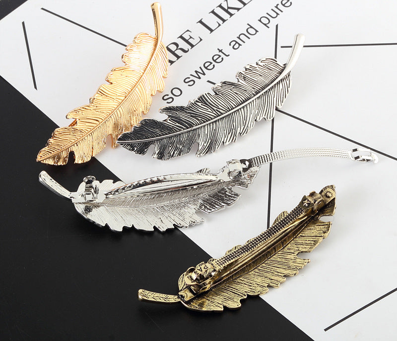Metallic feather hair barrette