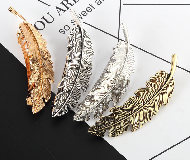 Metallic feather hair barrette