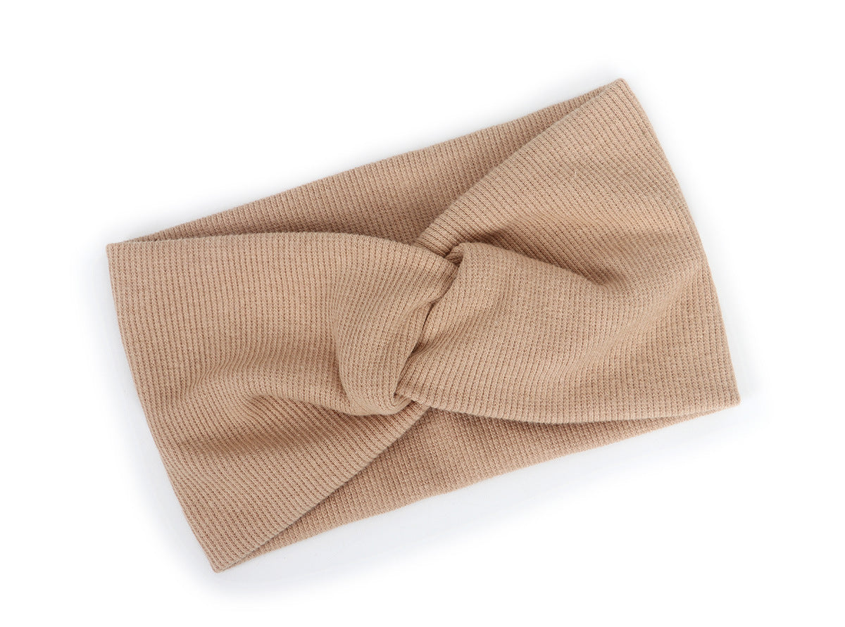 Twist front ribbed fabric stretch headband