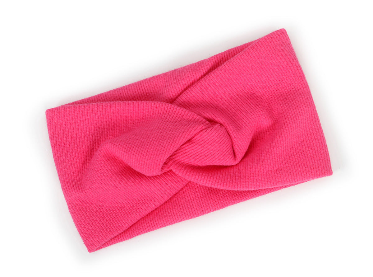 Twist front ribbed fabric stretch headband