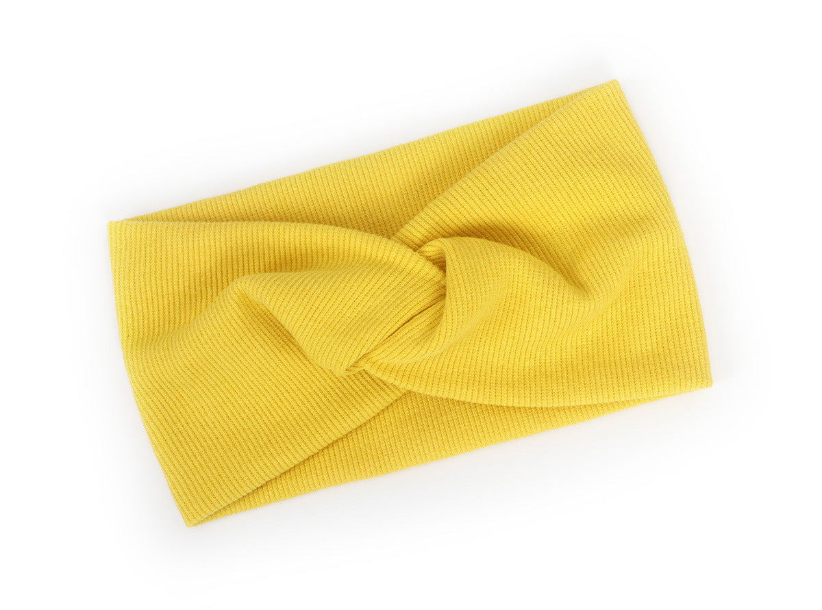 Twist front ribbed fabric stretch headband