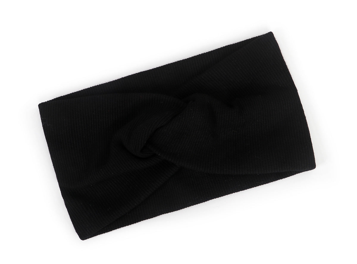 Twist front ribbed fabric stretch headband