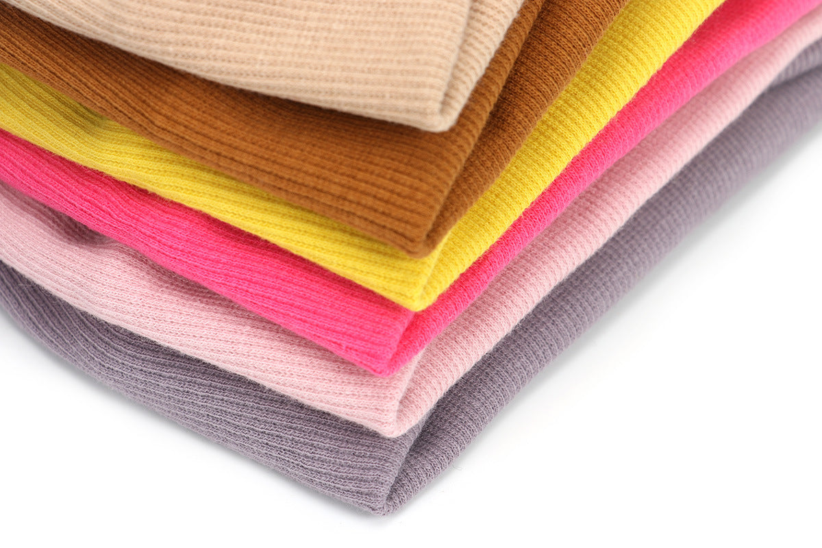Twist front ribbed fabric stretch headband