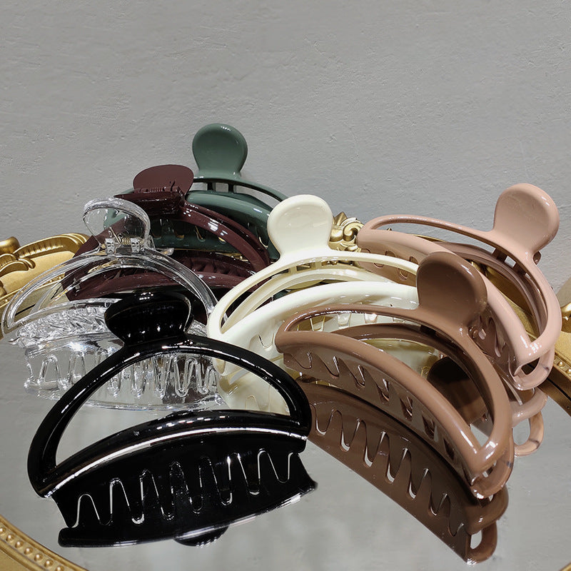 Crescent-shaped acrylic hair claw