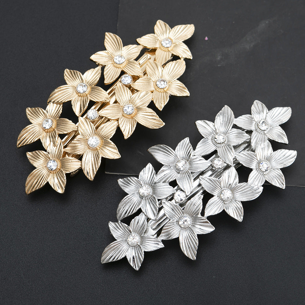 Metallic flowers hair barrette