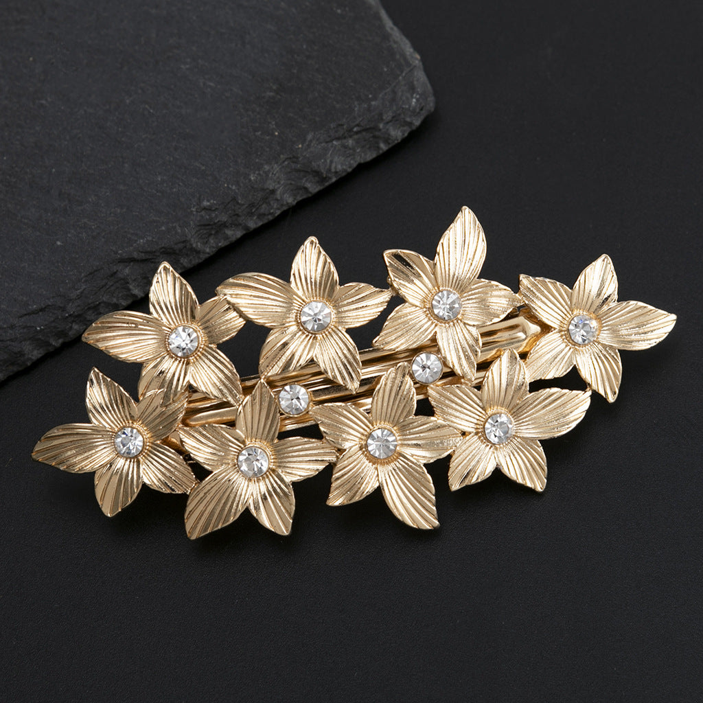 Metallic flowers hair barrette
