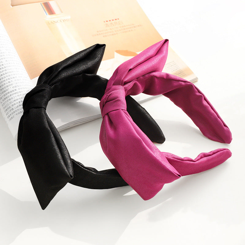 Glossy fabric headband with bow