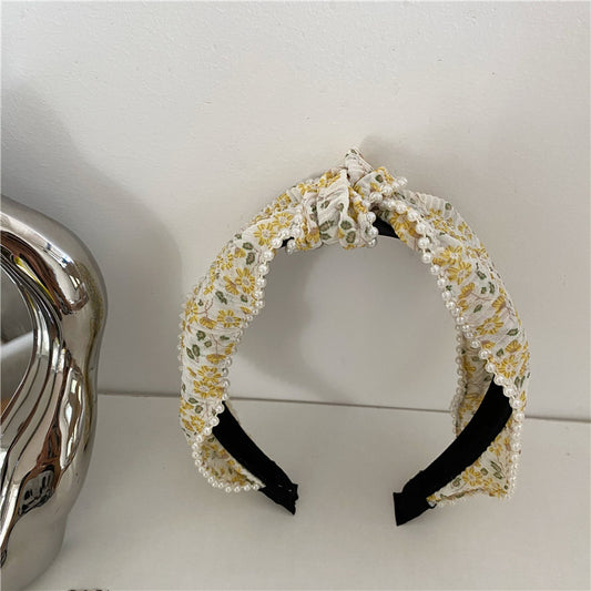 Chiffon floral knotted headband with white pearls edge