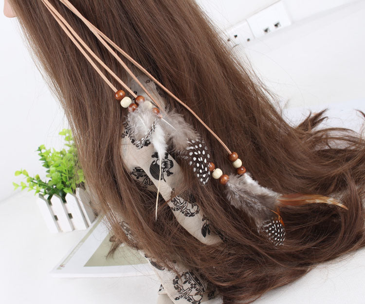 White spotted feather brown hair tie