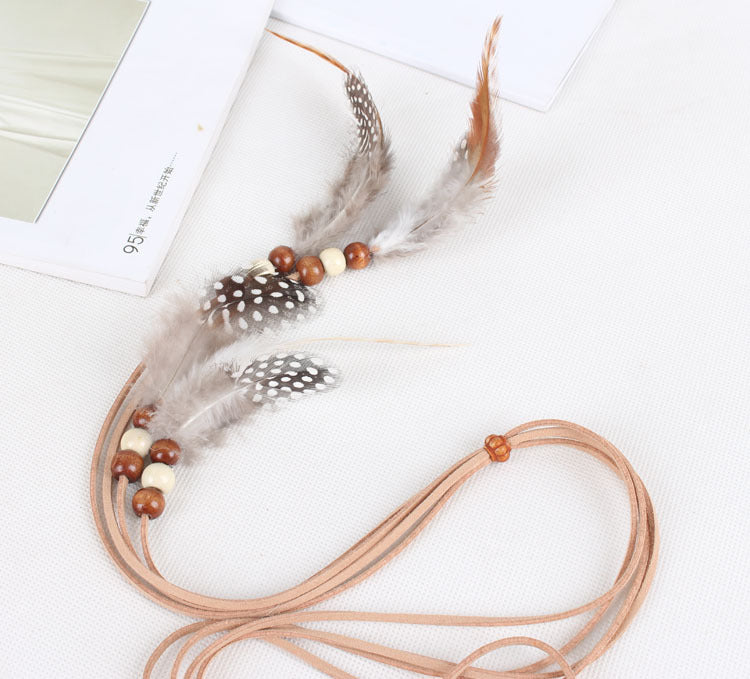 White spotted feather brown hair tie