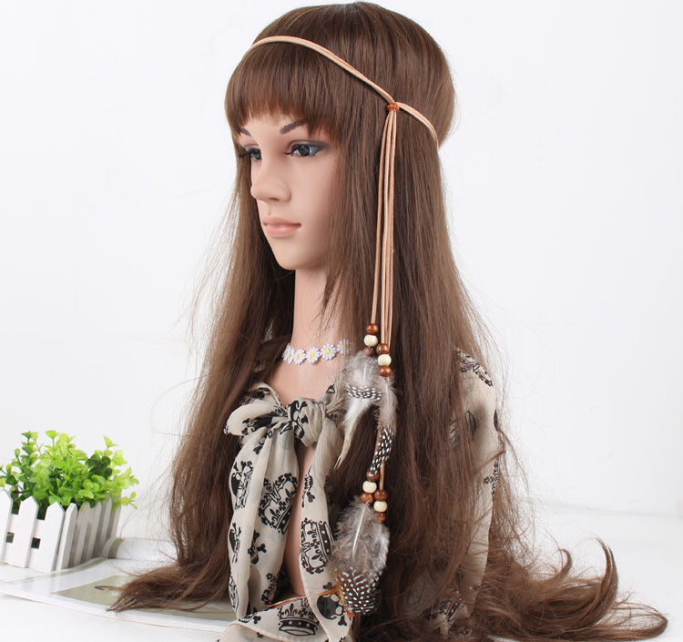 White spotted feather brown hair tie