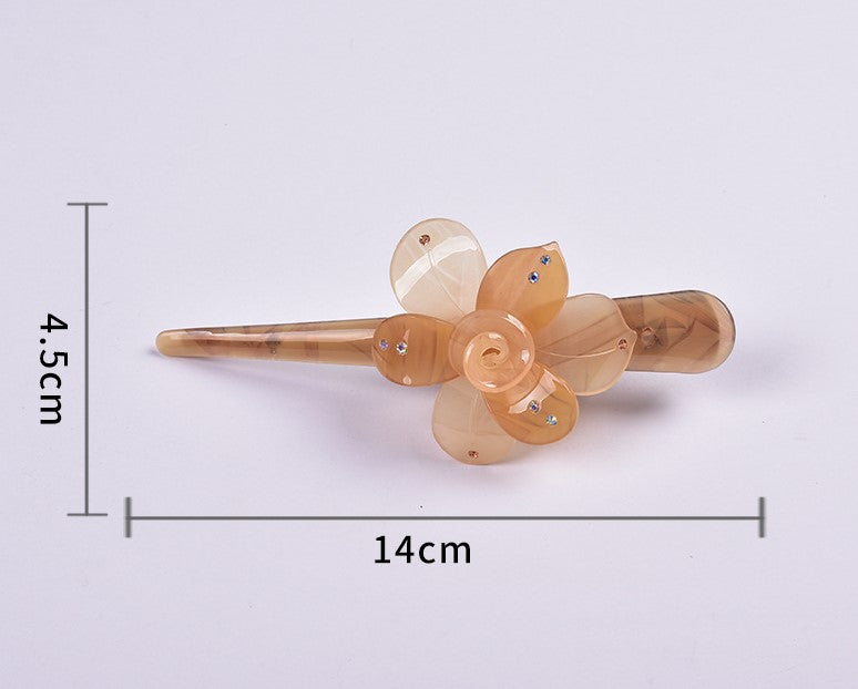Large resin Ibis clip with flower