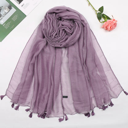 Plain long scarf with tassels