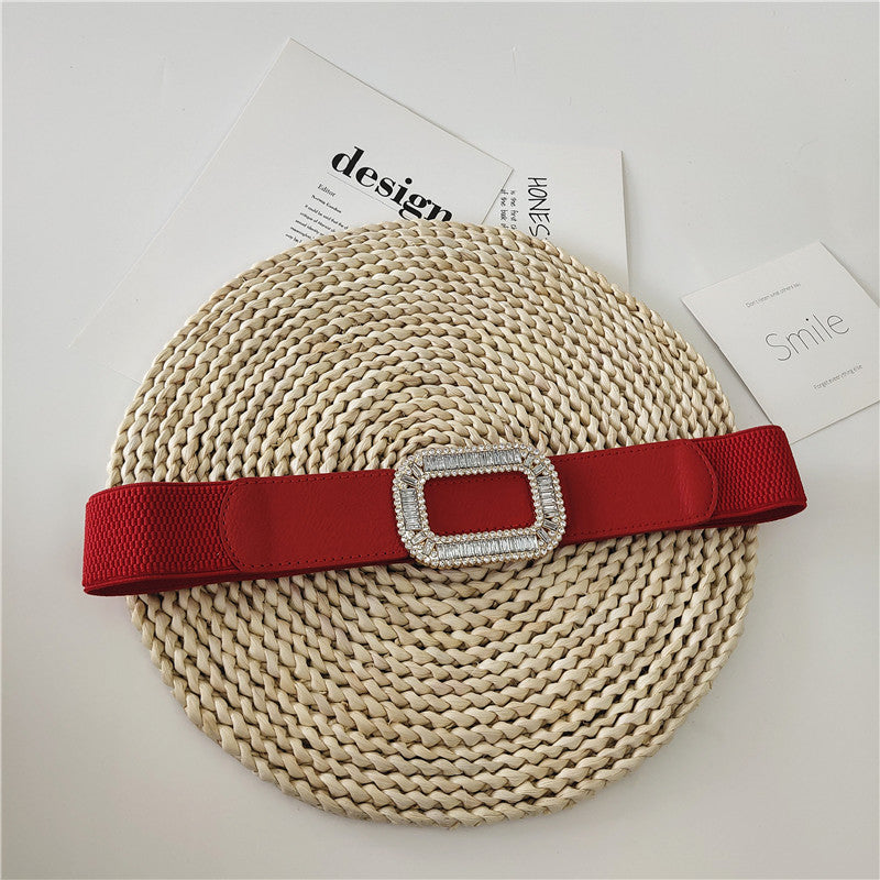 Stretch wide belt with shiny gems studded buckle