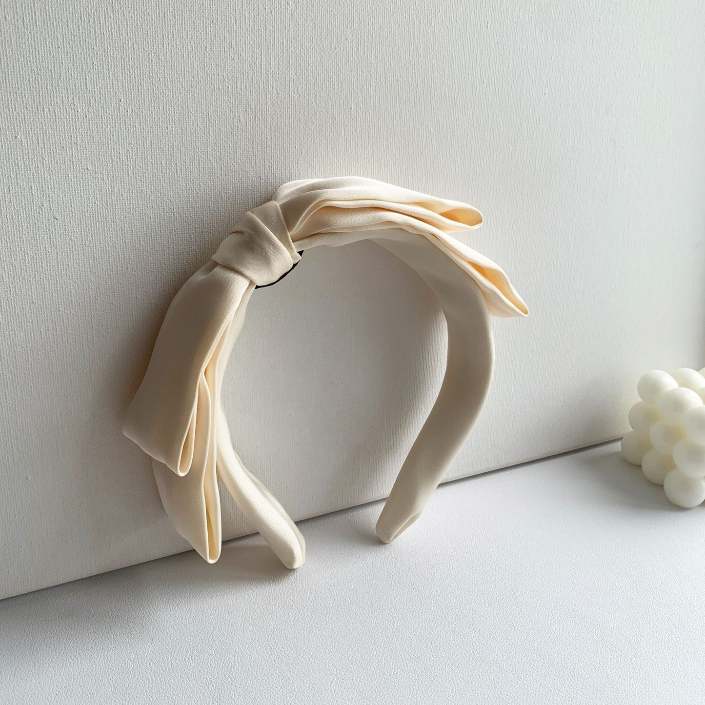 Soft headband with large bow in plain colours