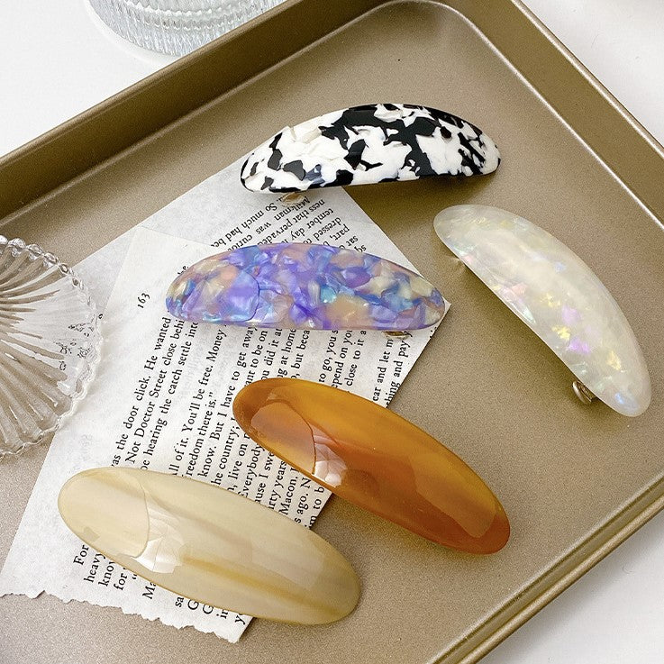 Multicoloured oval resin hair barrette