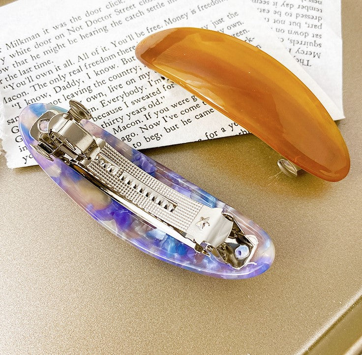Multicoloured oval resin hair barrette