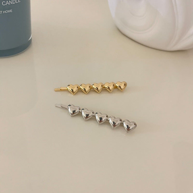 Metallic hearts hair slide