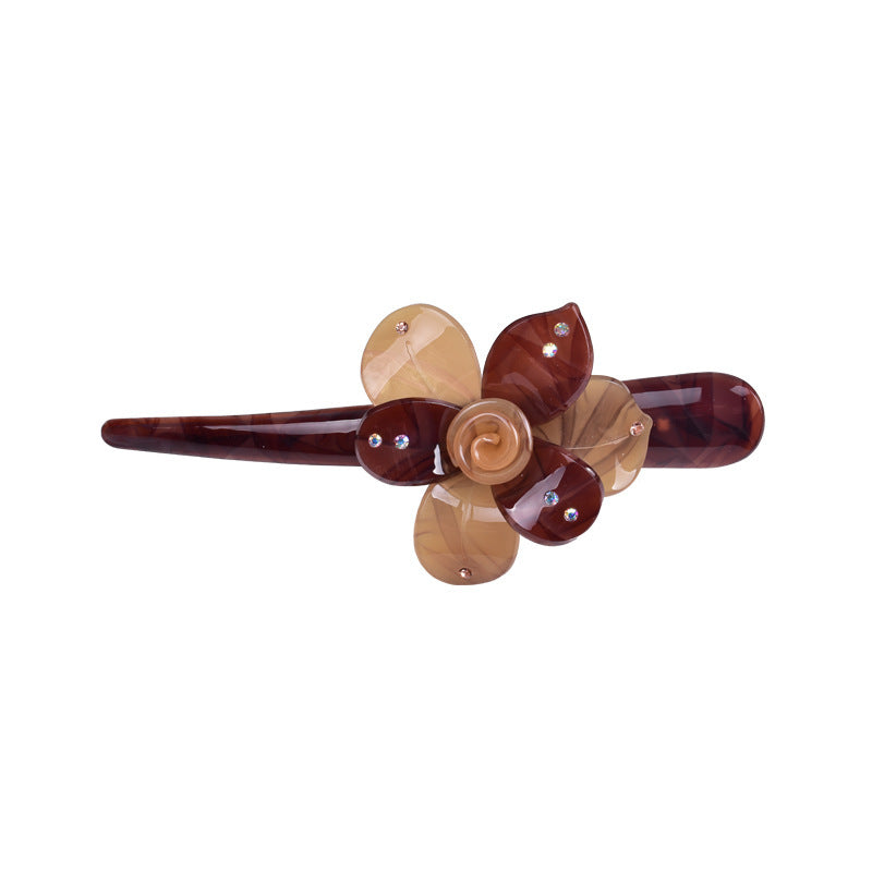 Large resin Ibis clip with flower
