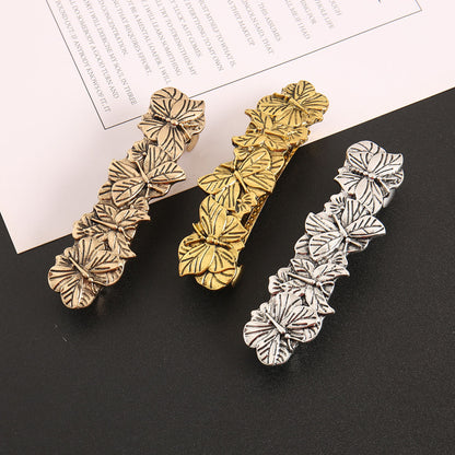 Antique metallic butterflies large hair barrette