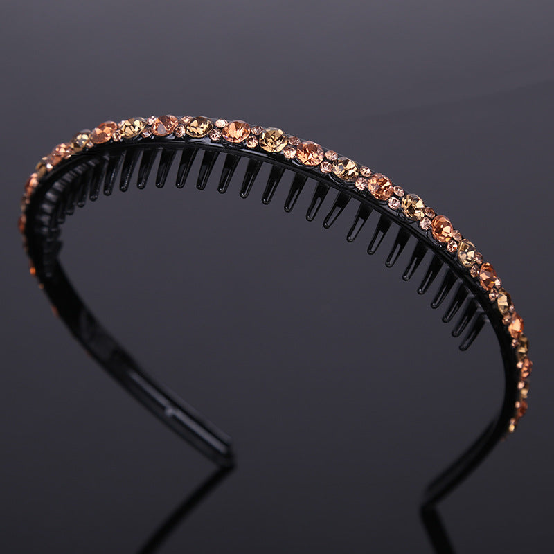 Rhinestone studded black acrylic headband with teeth