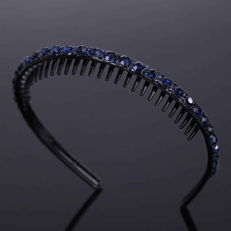 Rhinestone studded black acrylic headband with teeth