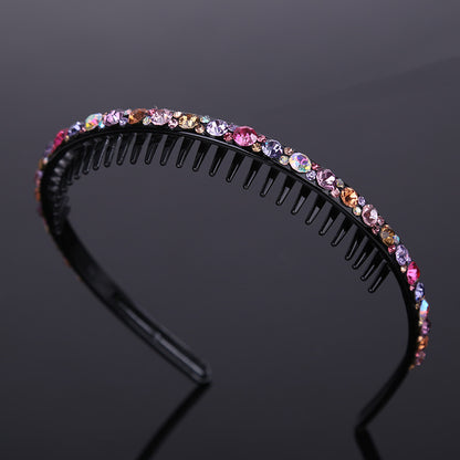 Rhinestone studded black acrylic headband with teeth