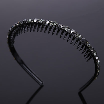 Rhinestone studded black acrylic headband with teeth