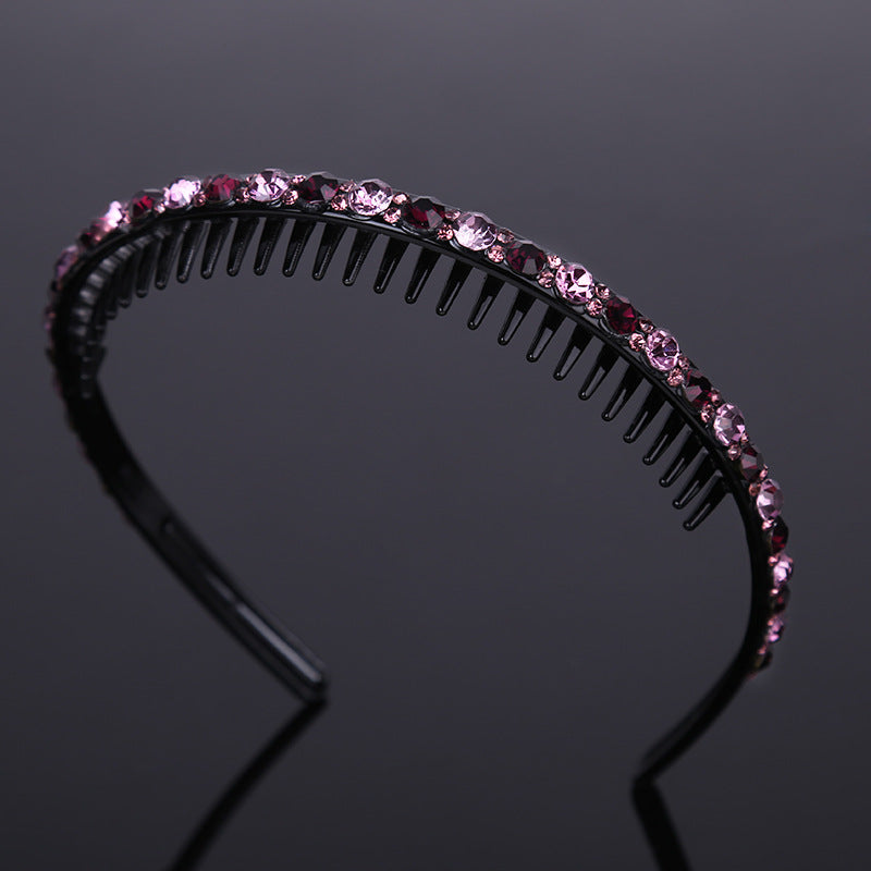 Rhinestone studded black acrylic headband with teeth