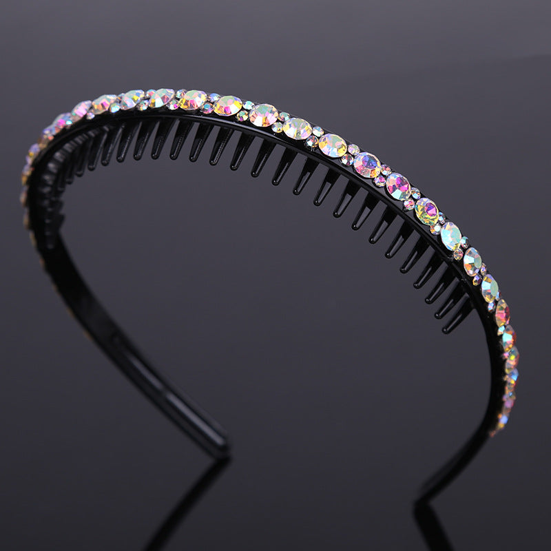 Rhinestone studded black acrylic headband with teeth