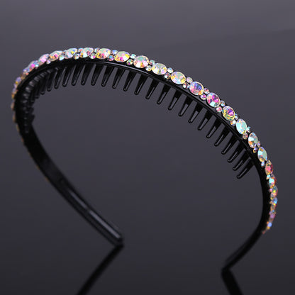 Rhinestone studded black acrylic headband with teeth