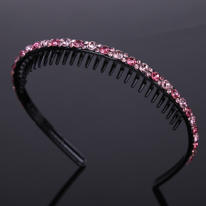 Rhinestone studded black acrylic headband with teeth